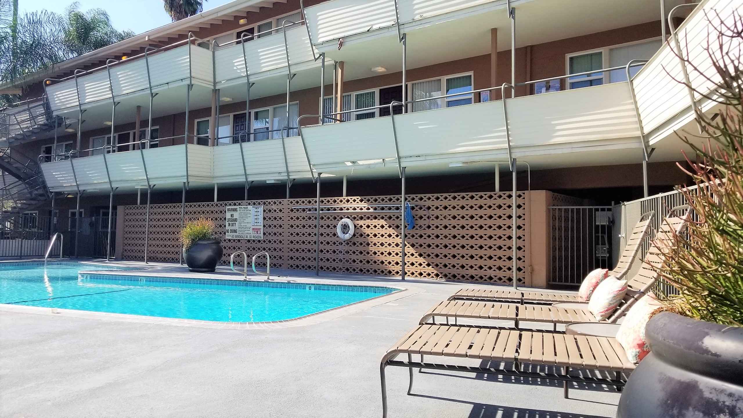 community pool with complex in background at Terraces
