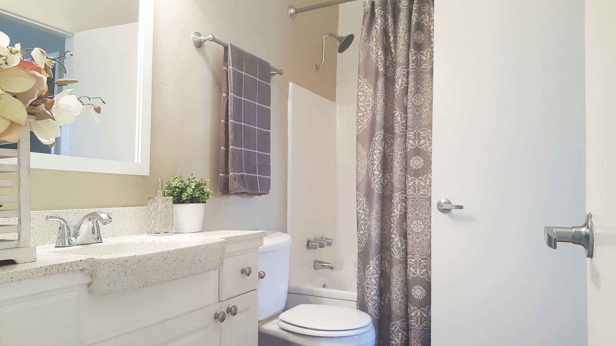 bathroom sink toilet shower at Terraces