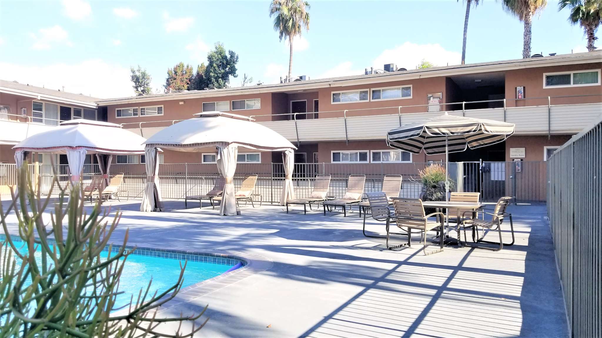 Terraces at South Pasadena community pool lounge area with chairs